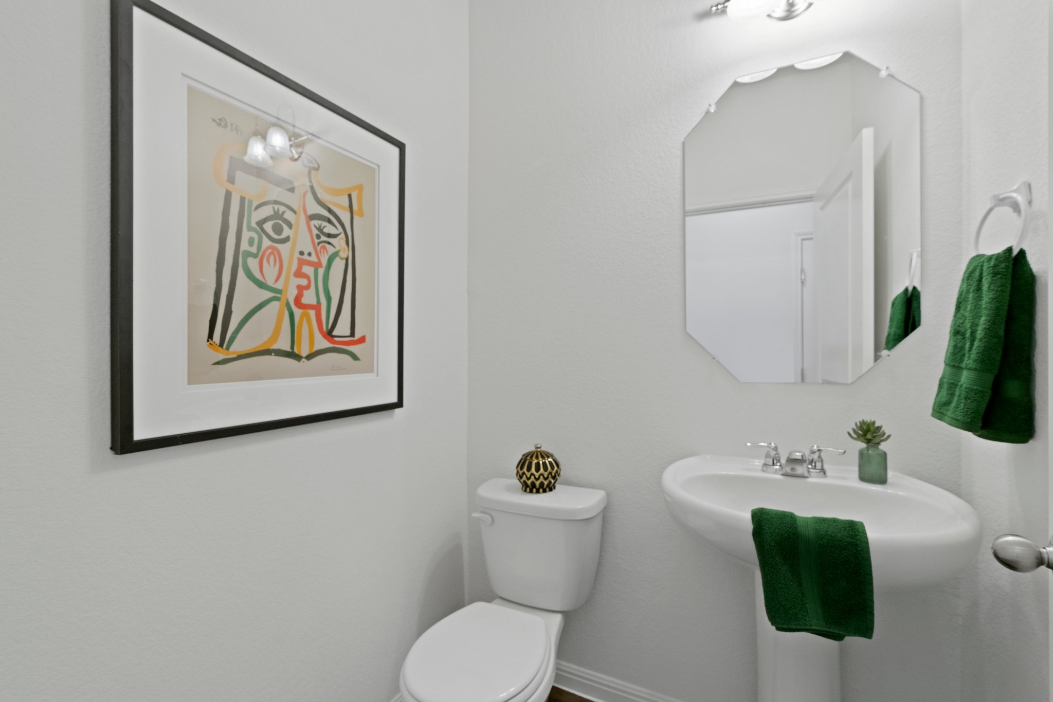 550 Bunton Reserve Boulevard Kyle, TX 78640 - Photo 19 of 32 A half bathroom is accessible on the main floor for guests and household members.