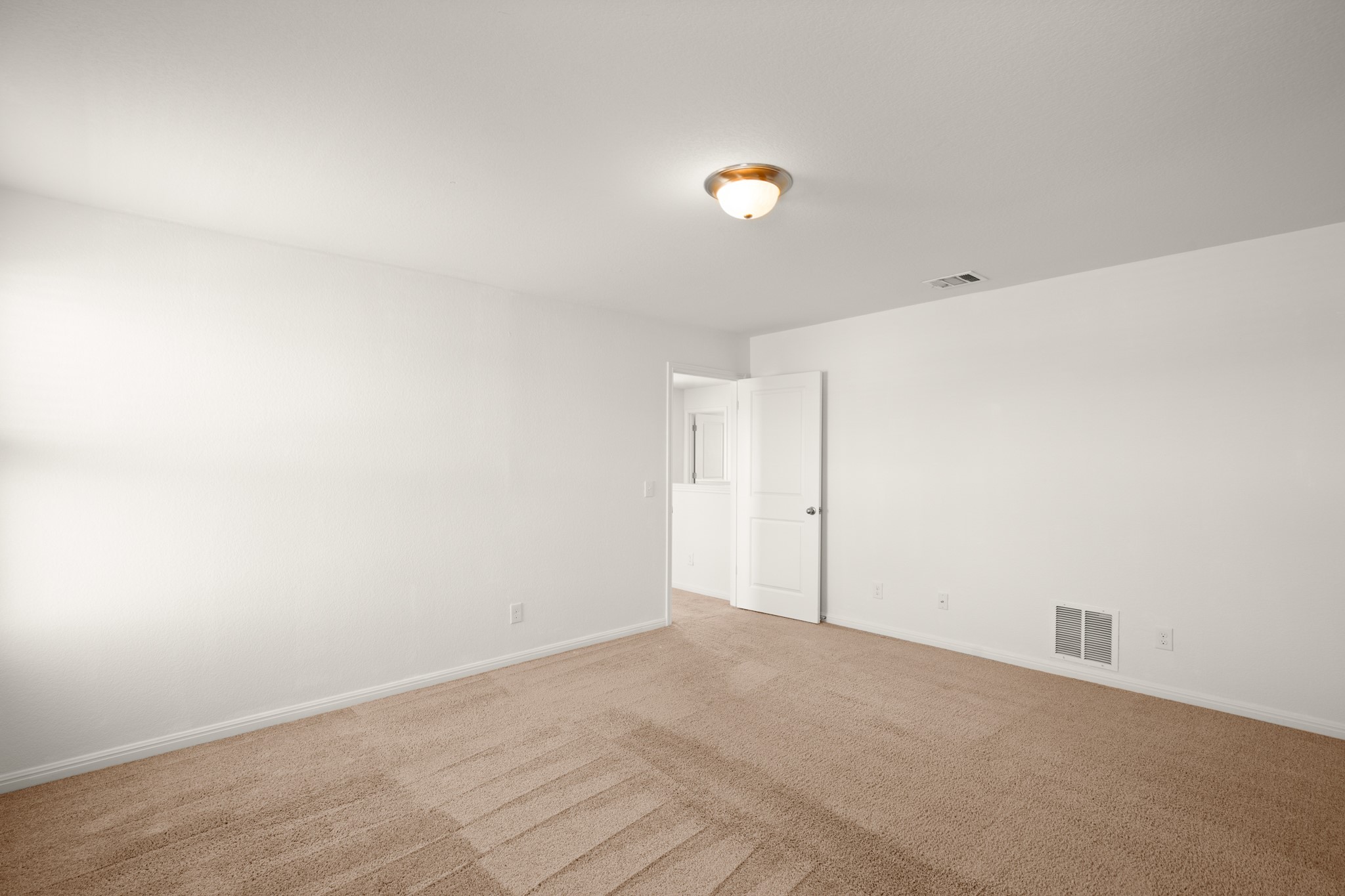 550 Bunton Reserve Boulevard Kyle, TX 78640 - Photo 20 of 32 Plush carpet flooring adds warmth and comfort underfoot.