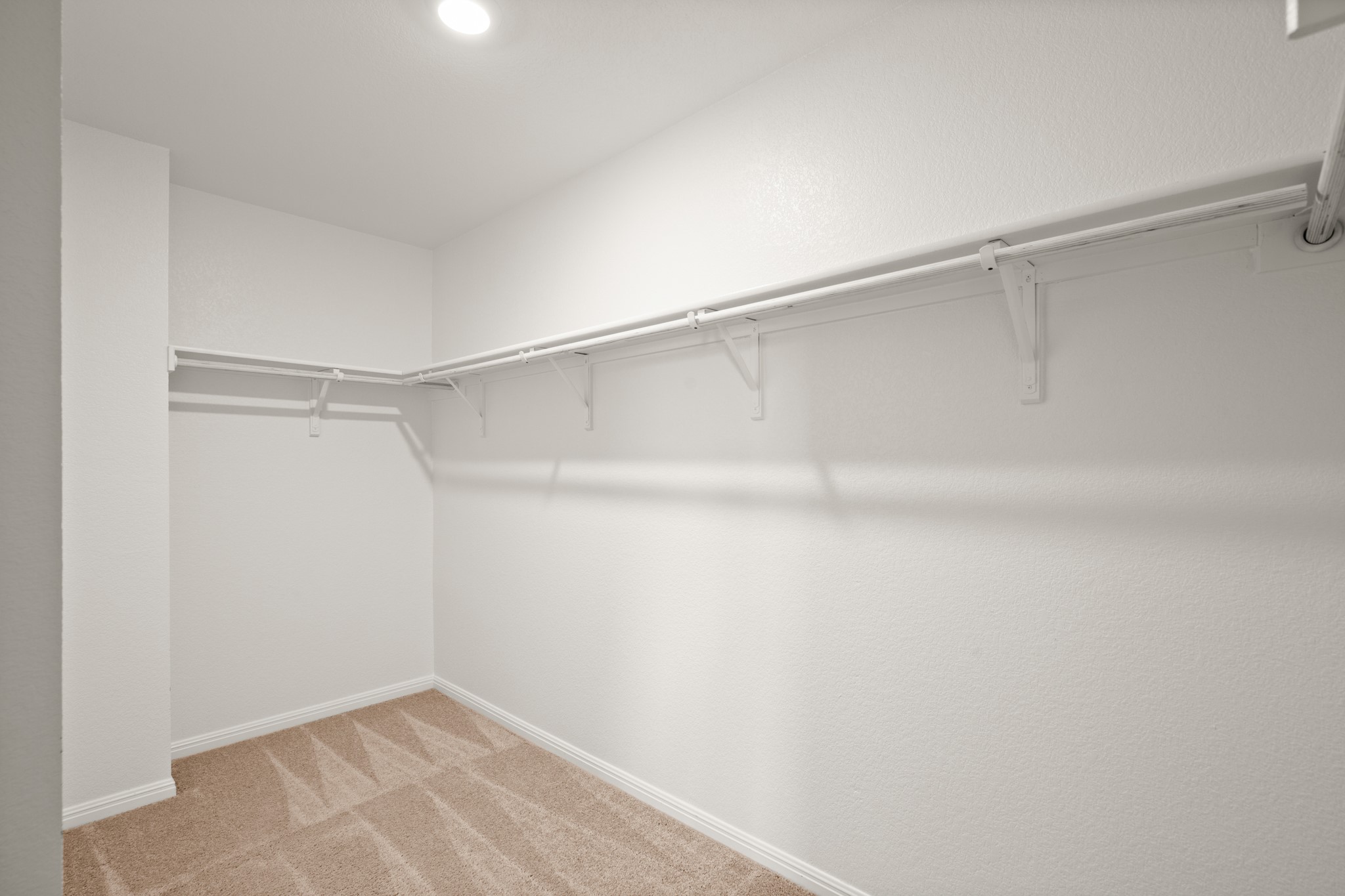 550 Bunton Reserve Boulevard Kyle, TX 78640 - Photo 21 of 32 A huge walk-in closet provides impressive storage and organization.