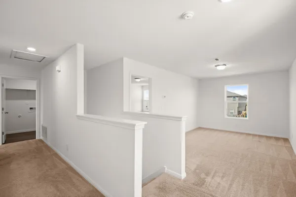 a bathroom with a granite countertop sink a toilet and a mirror