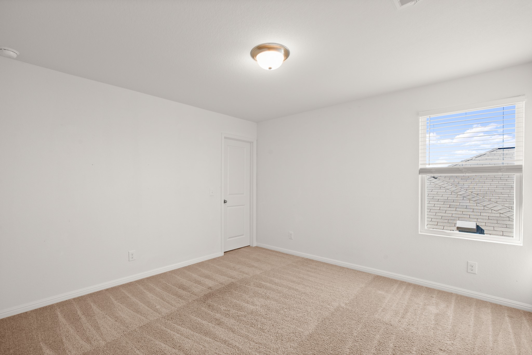 550 Bunton Reserve Boulevard Kyle, TX 78640 - Photo 25 of 32 Two additional bedrooms offer flexibility for family, guests, or hobbies.