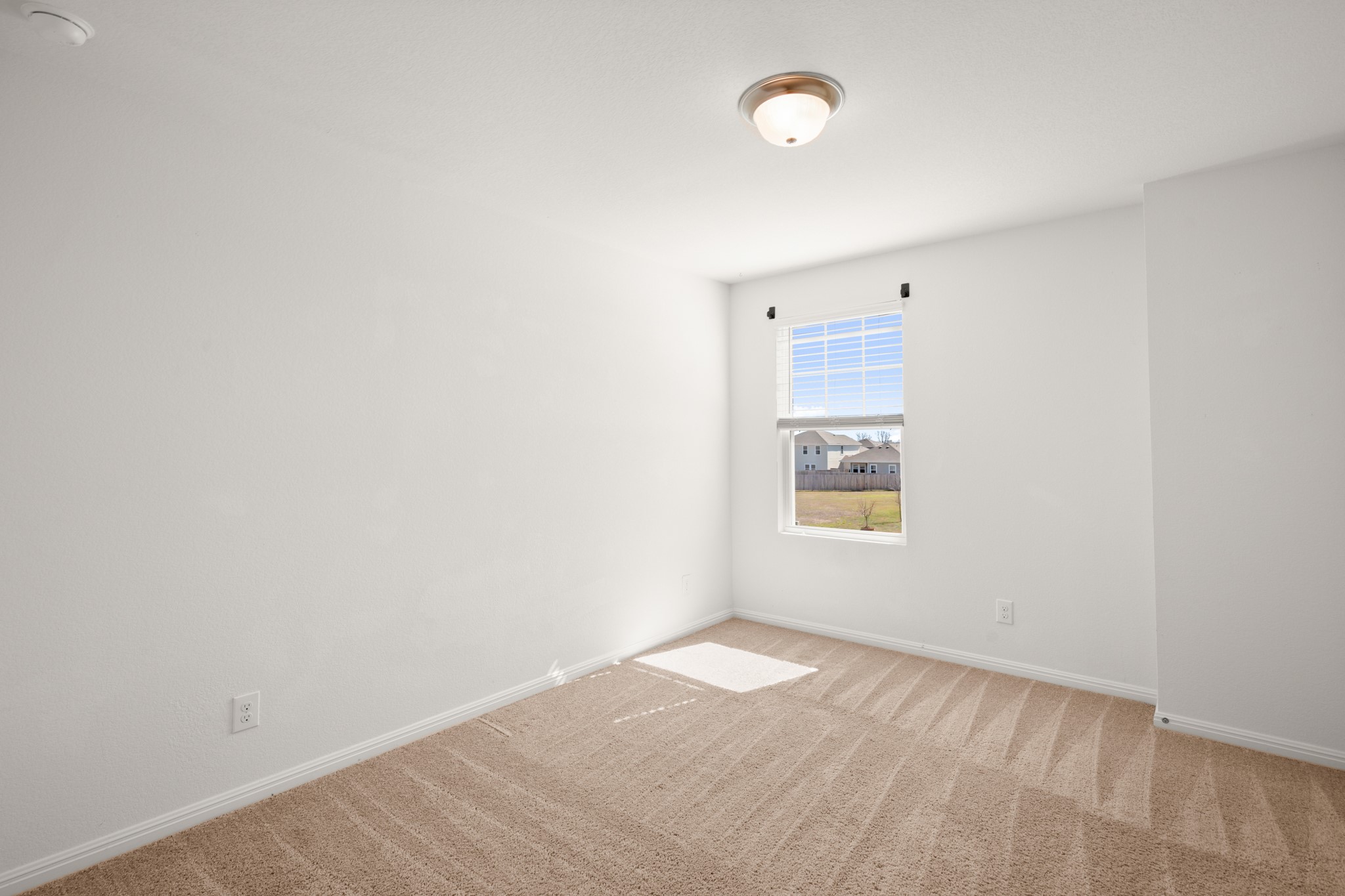 550 Bunton Reserve Boulevard Kyle, TX 78640 - Photo 26 of 32 Each room features comfortable carpeting and natural light.