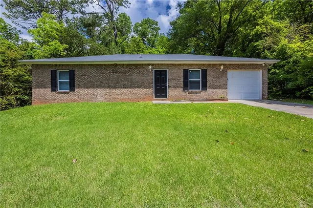 front view of a house with yard