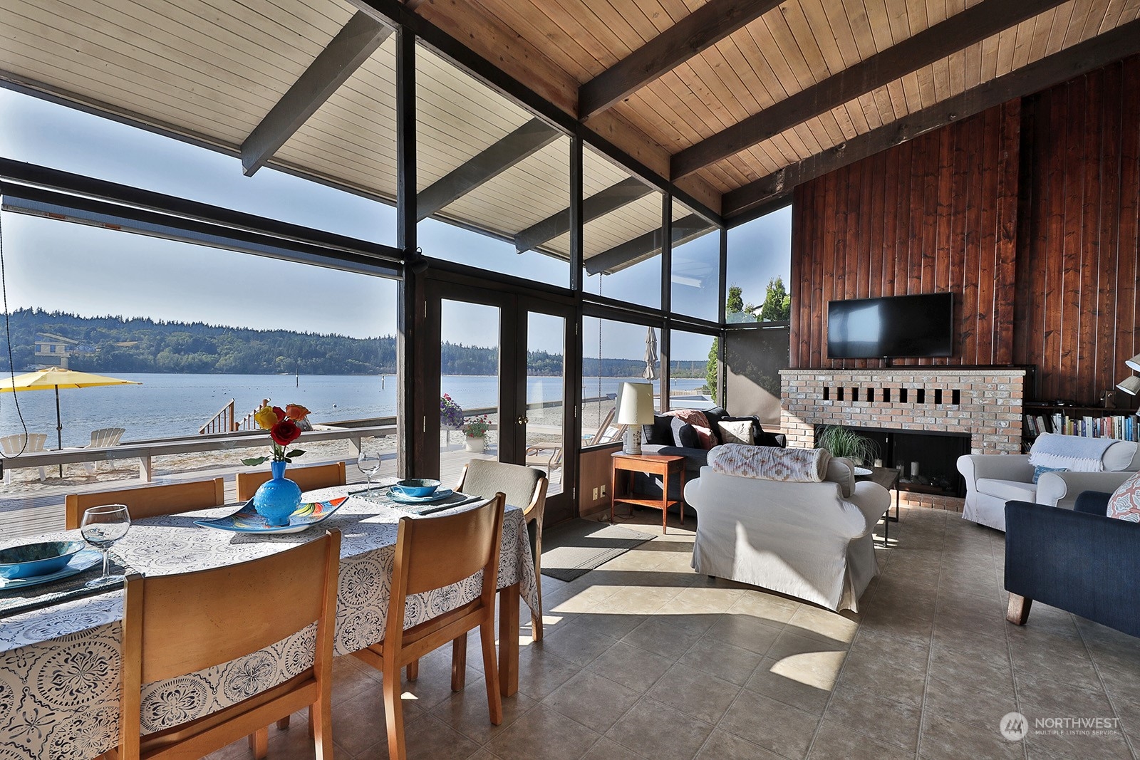 8166 Sandy Hook Drive Clinton, WA 98236 - Photo 14 of 40 a living room with furniture and a flat screen tv