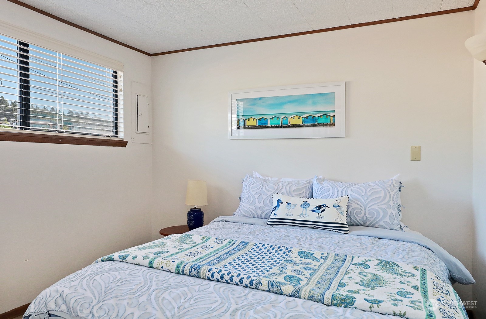 8166 Sandy Hook Drive Clinton, WA 98236 - Photo 20 of 40 a bedroom with a bed and a window