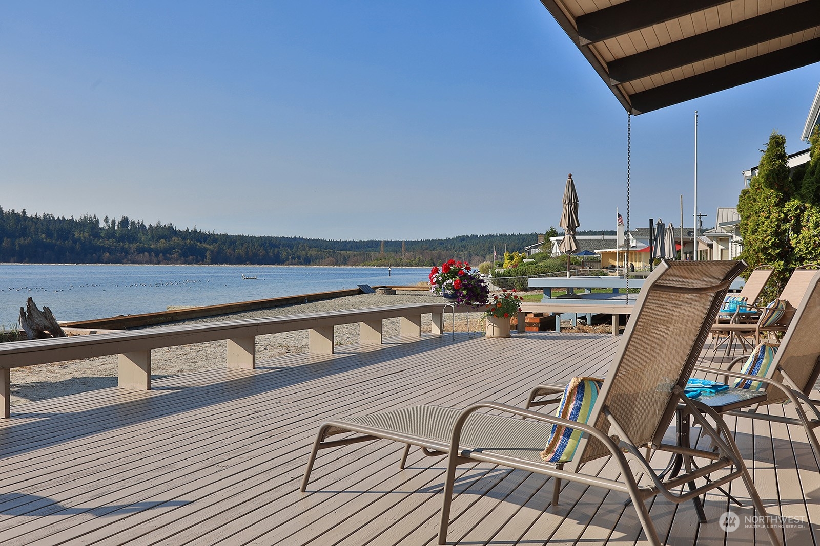 8166 Sandy Hook Drive Clinton, WA 98236 - Photo 2 of 40 a view of a chairs and table on the terrace