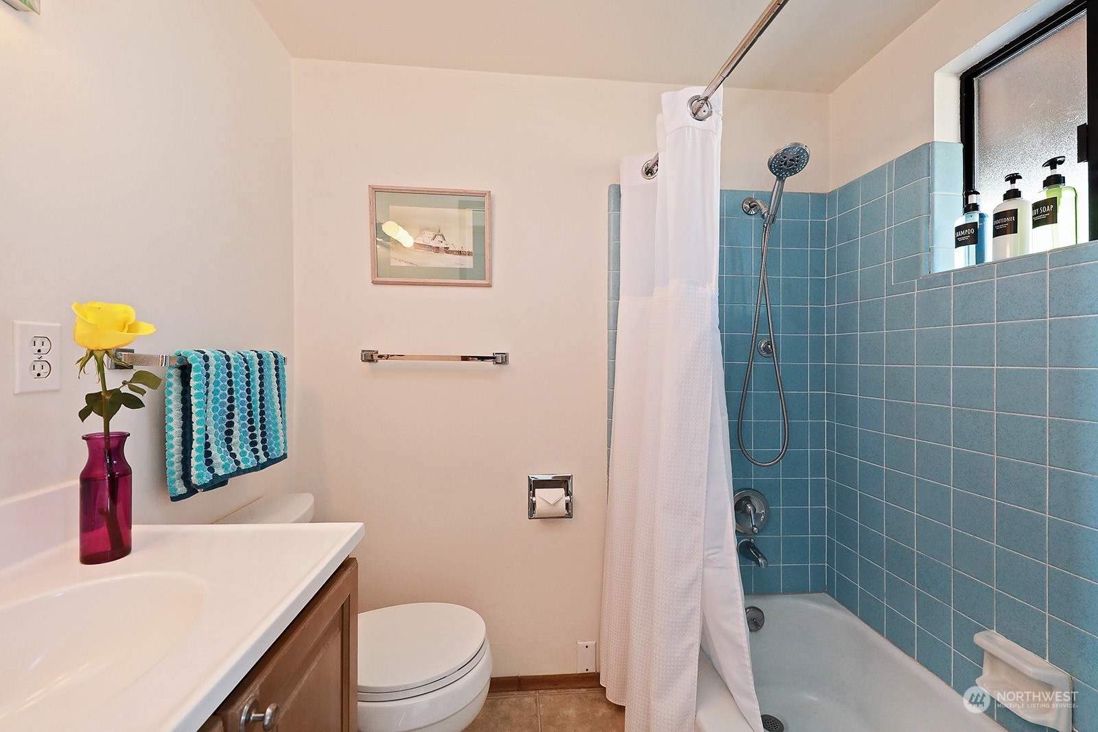8166 Sandy Hook Drive Clinton, WA 98236 - Photo 23 of 40 a bathroom with a sink a toilet and shower
