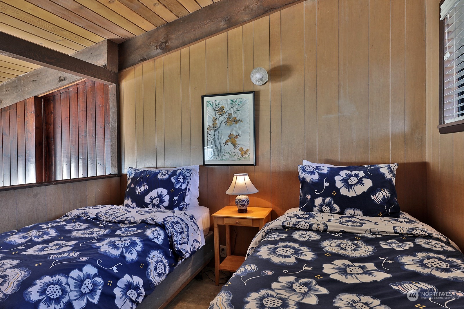 8166 Sandy Hook Drive Clinton, WA 98236 - Photo 29 of 40 a bedroom with bed and window