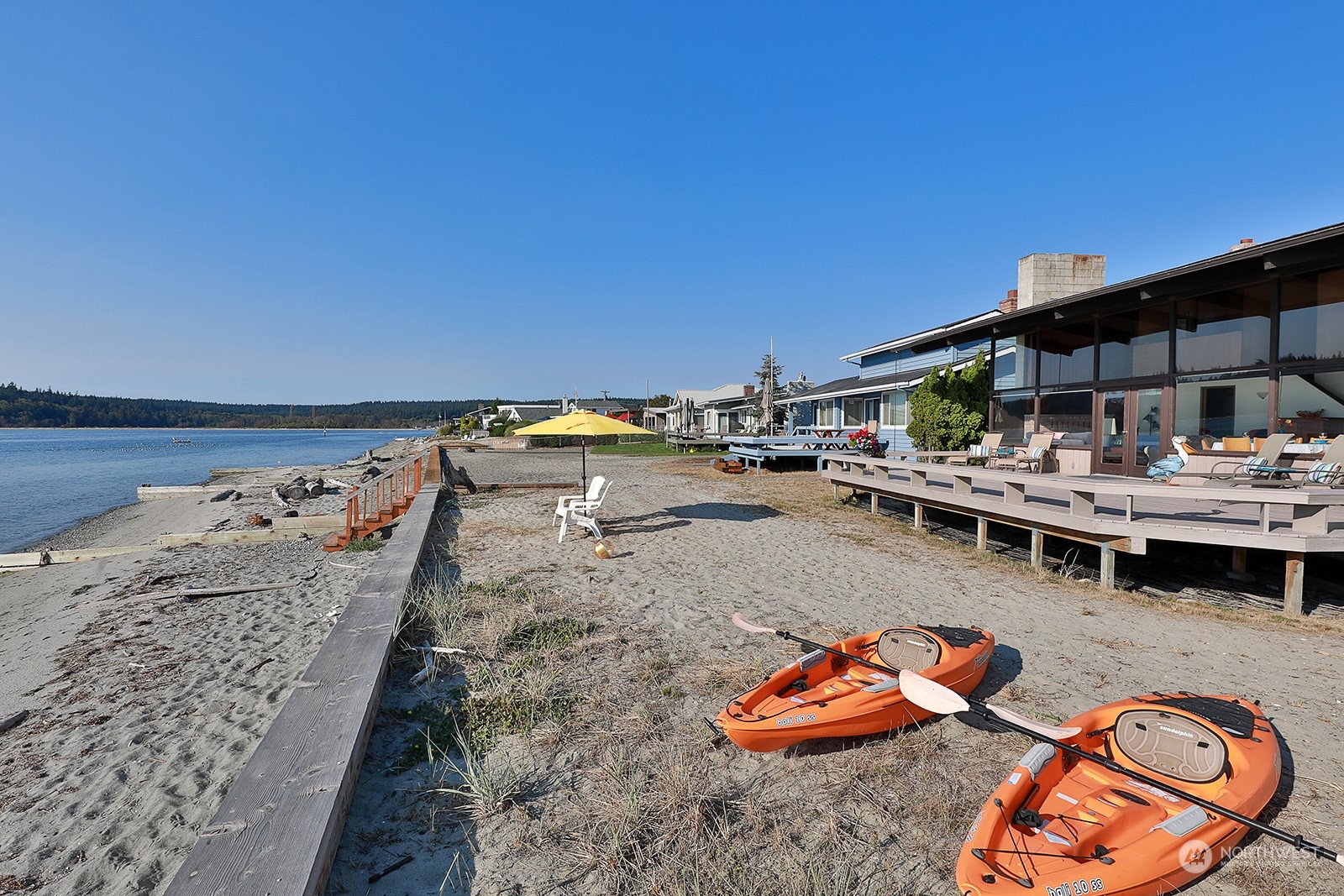 8166 Sandy Hook Drive Clinton, WA 98236 - Photo 34 of 40 a backyard with furniture and water view