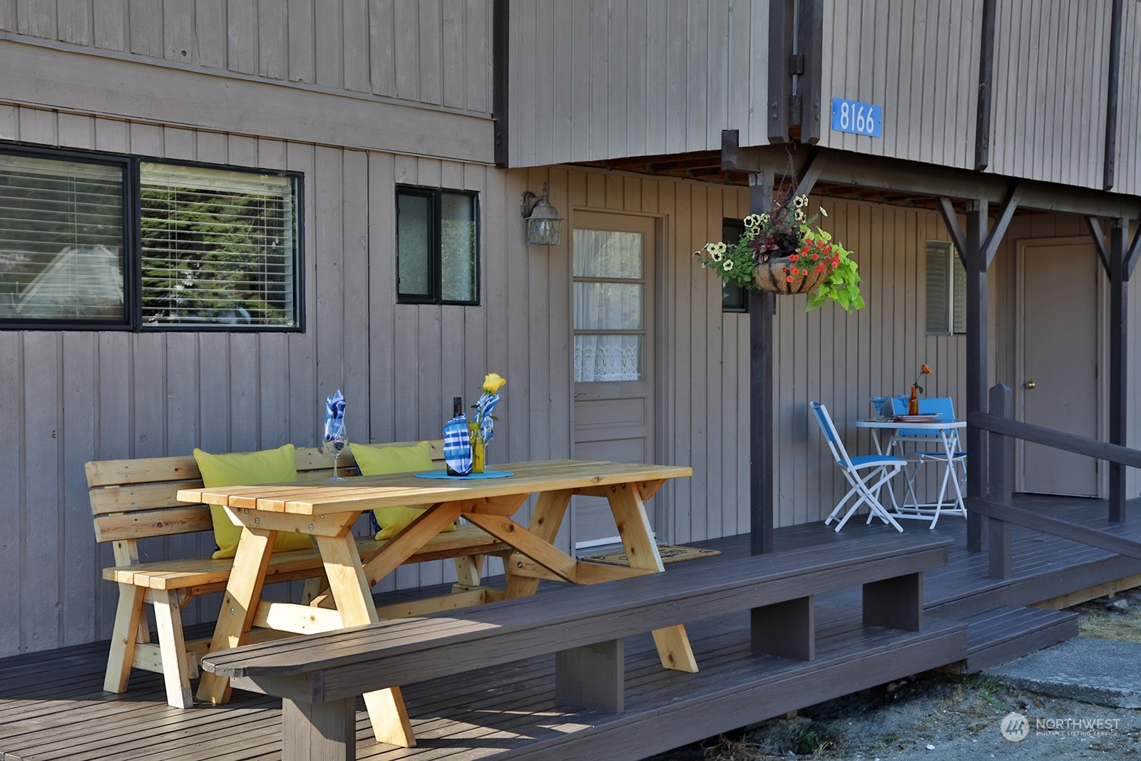 8166 Sandy Hook Drive Clinton, WA 98236 - Photo 9 of 40 a view of a dining room with furniture and chandelier