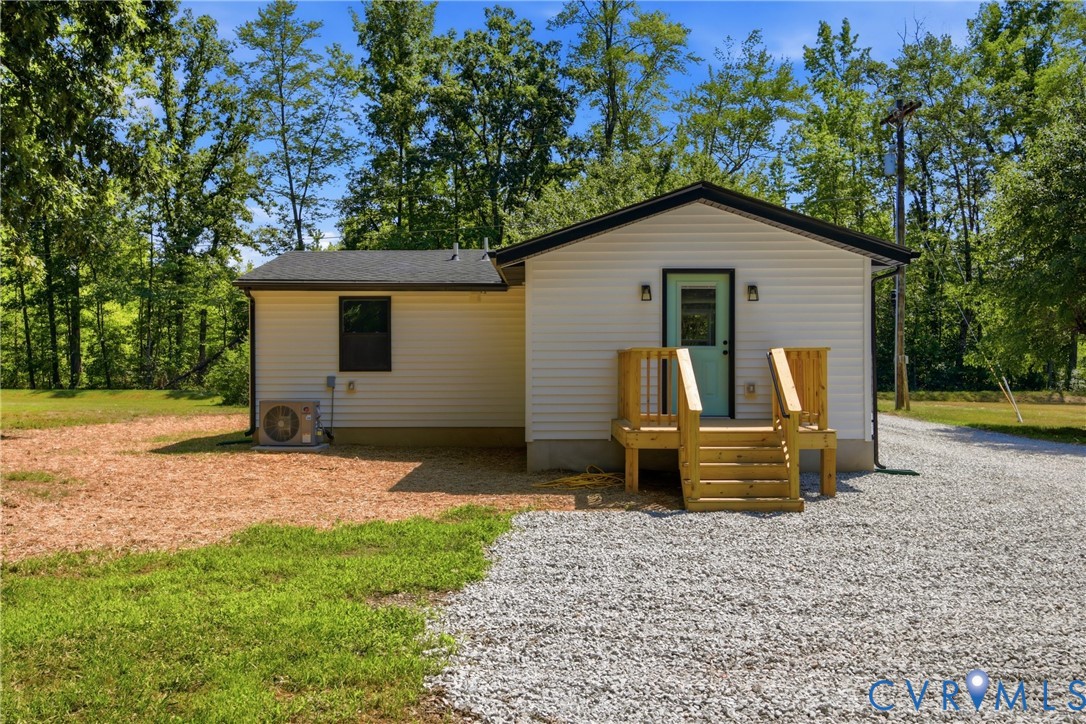 3497 Bumpass Road Beaverdam, VA 23015 - Photo 19 of 28 White siding exterior with black trim, a light blu