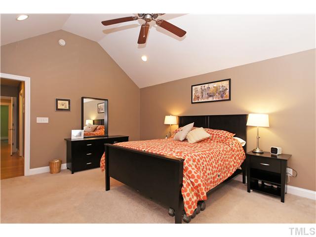 2827 Mayview Road Raleigh, NC 27607 - Photo 11 of 24 a bedroom with a bed and dresser