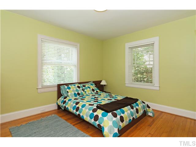 2827 Mayview Road Raleigh, NC 27607 - Photo 15 of 24 a bedroom with a bed and a window