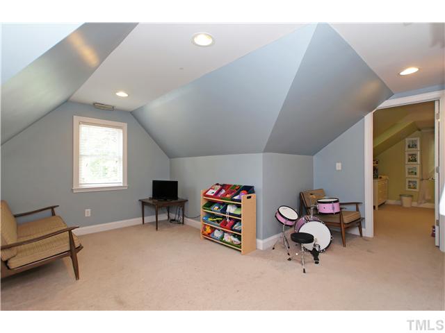 2827 Mayview Road Raleigh, NC 27607 - Photo 20 of 24 a living room with furniture and a flat screen tv