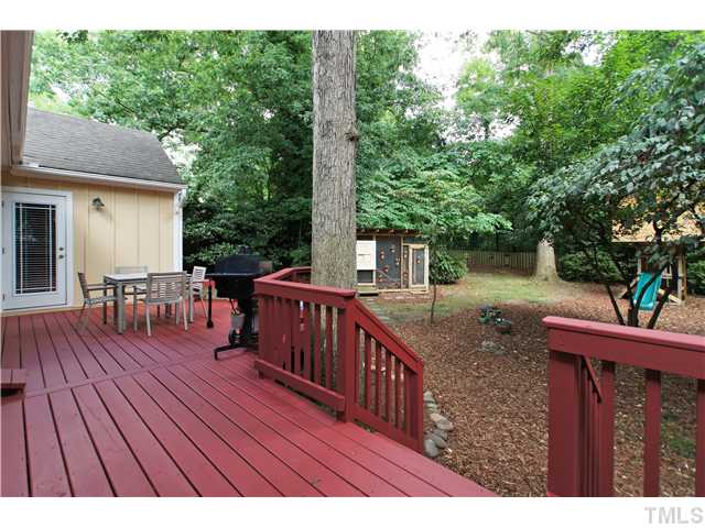 2827 Mayview Road Raleigh, NC 27607 - Photo 22 of 24 a balcony with wooden floor and outdoor seating