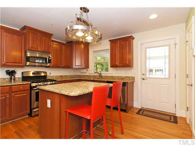 2827 Mayview Road Raleigh, NC 27607 - Photo 7 of 24 a kitchen with stainless steel appliances granite countertop a sink dishwasher a stove a microwave oven with granite countertops and cabinets