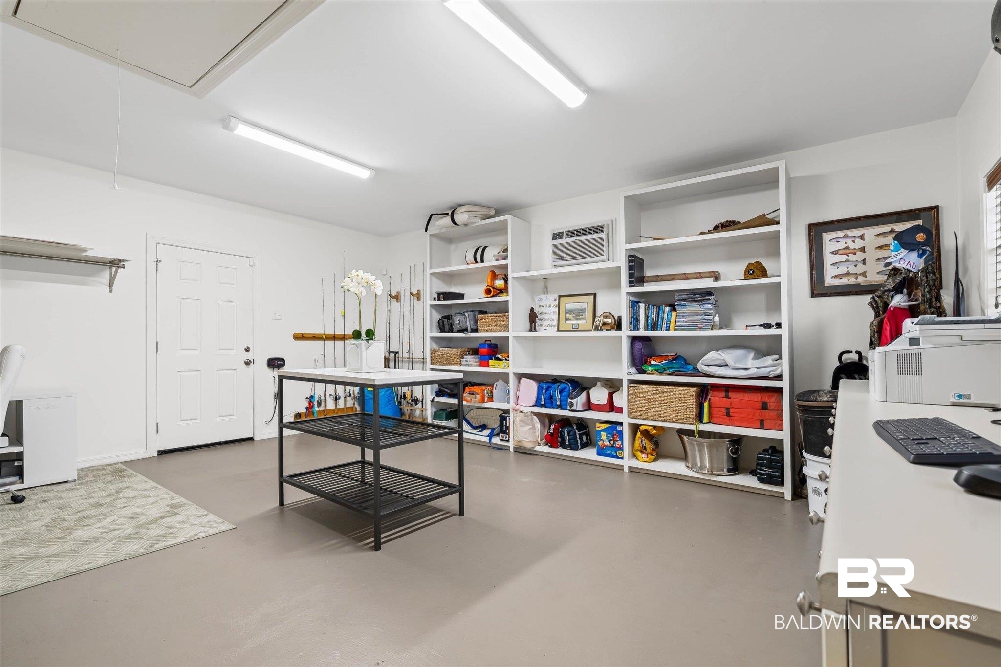 513 Spring Park Drive East Mobile, AL 36608 - Photo 34 of 44 Game room with attic access, a desk, concrete floors, and an AC wall unit