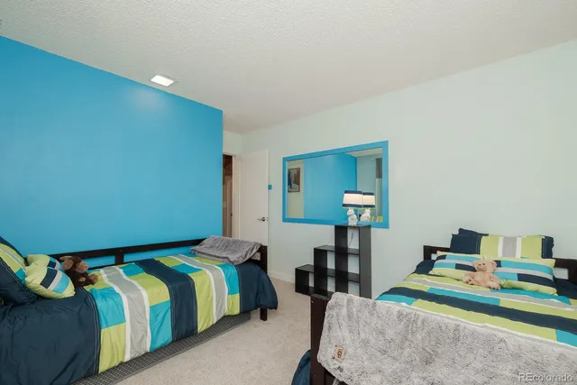 a bedroom with a bed and a table