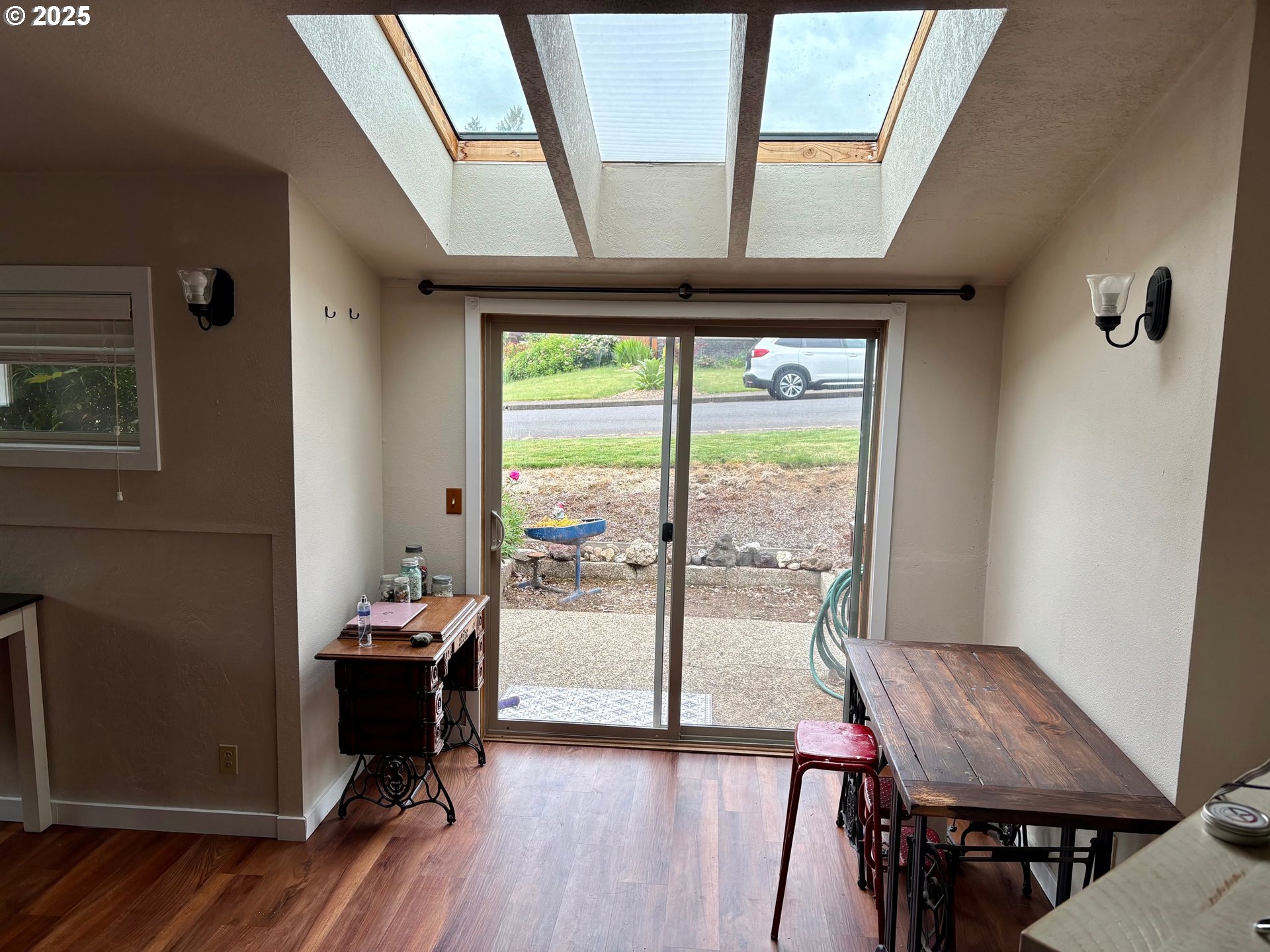 892 South 55th Place Springfield, OR 97478 - Photo 12 of 35 a view of a dining room with furniture window and wooden floor