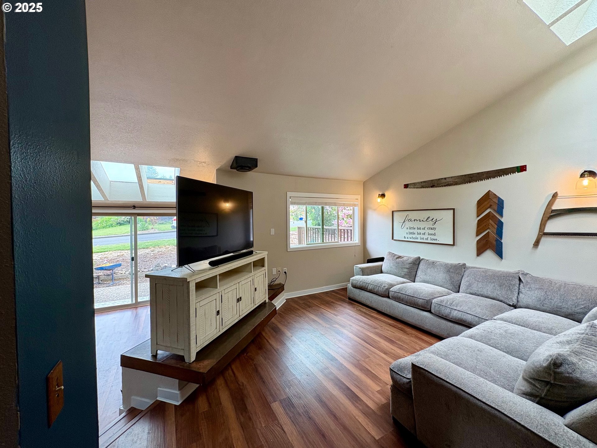892 South 55th Place Springfield, OR 97478 - Photo 10 of 35 a living room with furniture and a flat screen tv