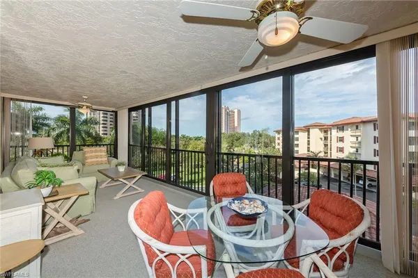a outdoor dining space with furniture and outdoor view