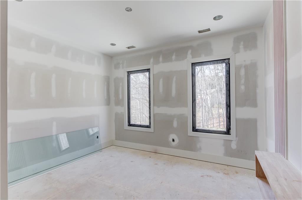 806 Riverside Road Sugar Hill, GA 30518 - Photo 29 of 40 a view of an empty room with window and cabinet area
