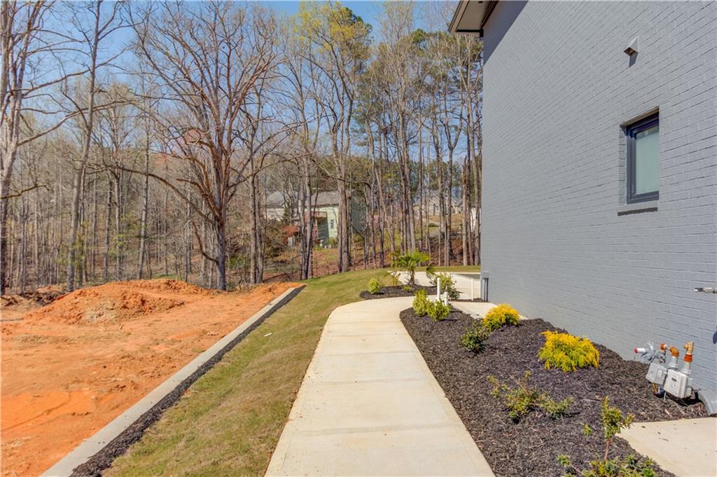 806 Riverside Road Sugar Hill, GA 30518 - Photo 36 of 40 a swimming pool with potted plants