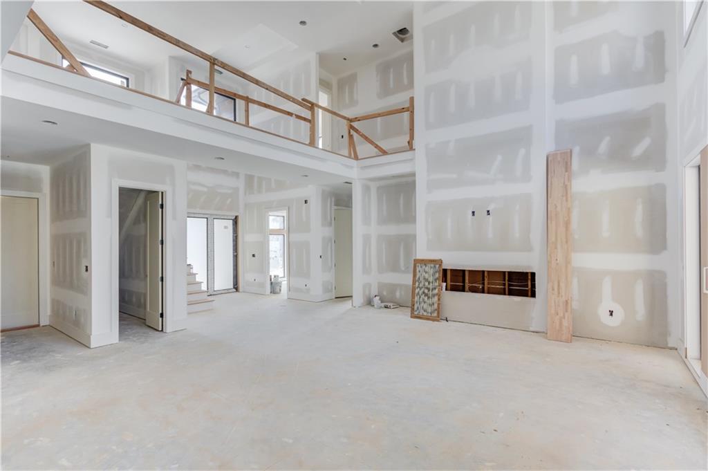 806 Riverside Road Sugar Hill, GA 30518 - Photo 7 of 40 a view of a big room with staircase