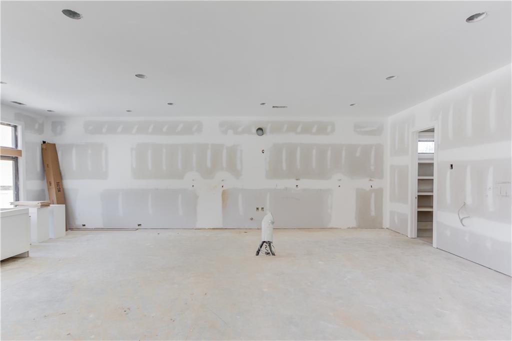 806 Riverside Road Sugar Hill, GA 30518 - Photo 8 of 40 a view of empty room with wooden floor