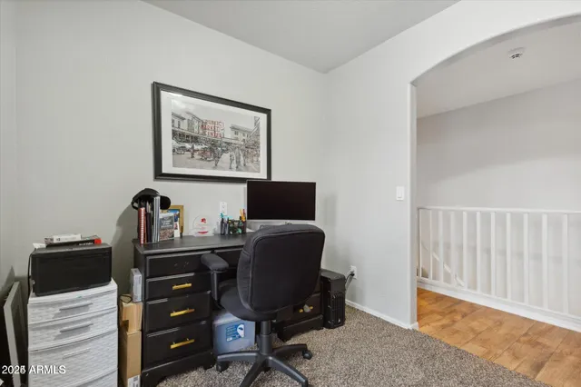 a view of workspace with wooden floor