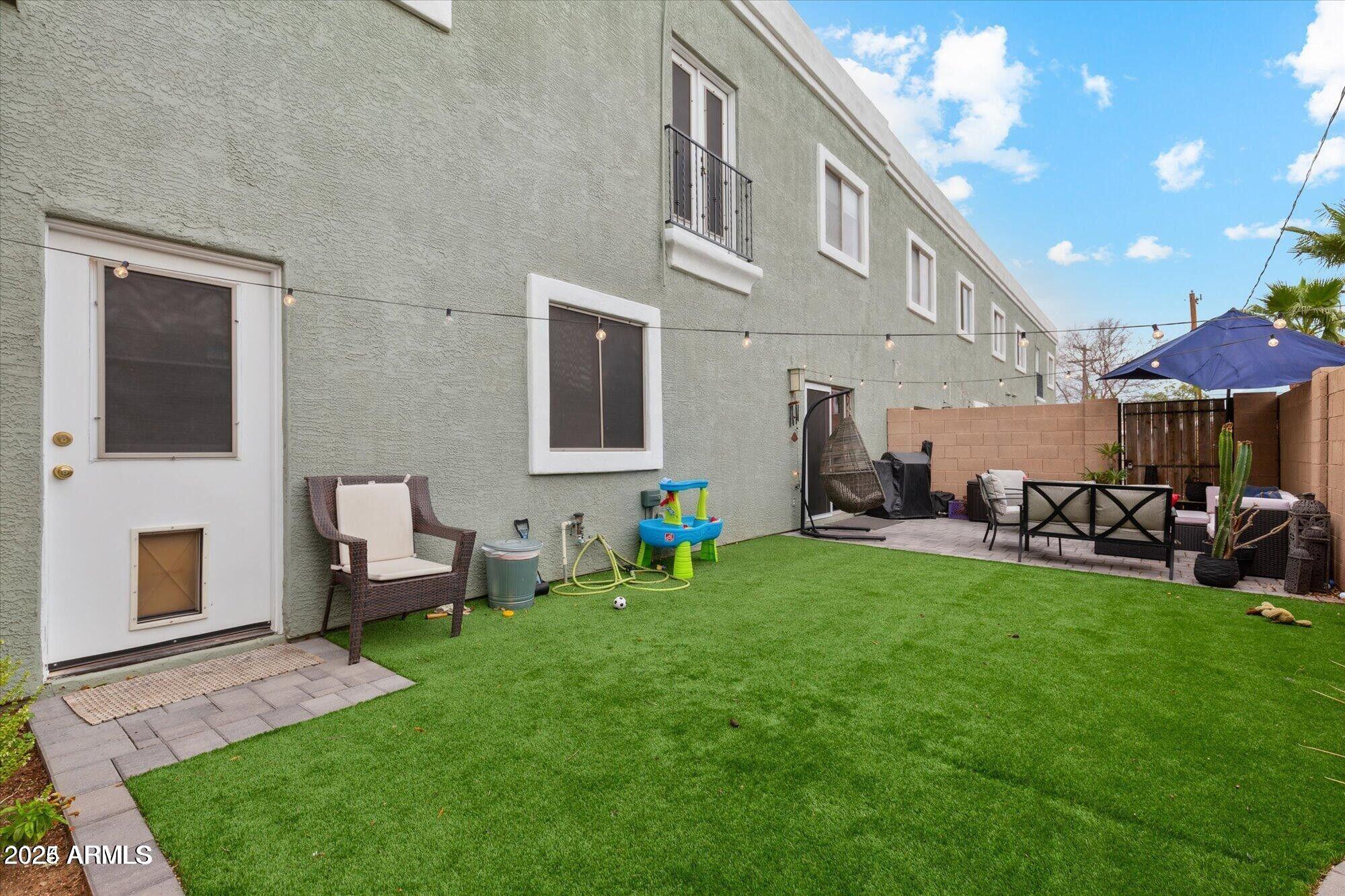 5210 North 16th Drive Phoenix, AZ 85015 - Photo 22 of 26 a view of a house with backyard sitting area and garden