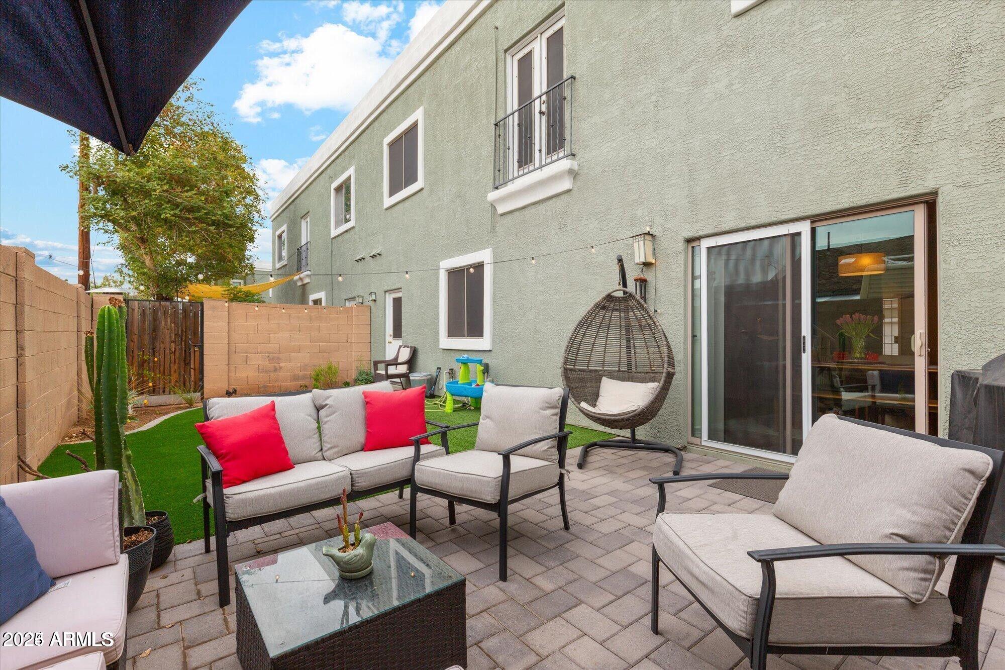 5210 North 16th Drive Phoenix, AZ 85015 - Photo 23 of 26 a outdoor living with furniture a rug and a potted plant