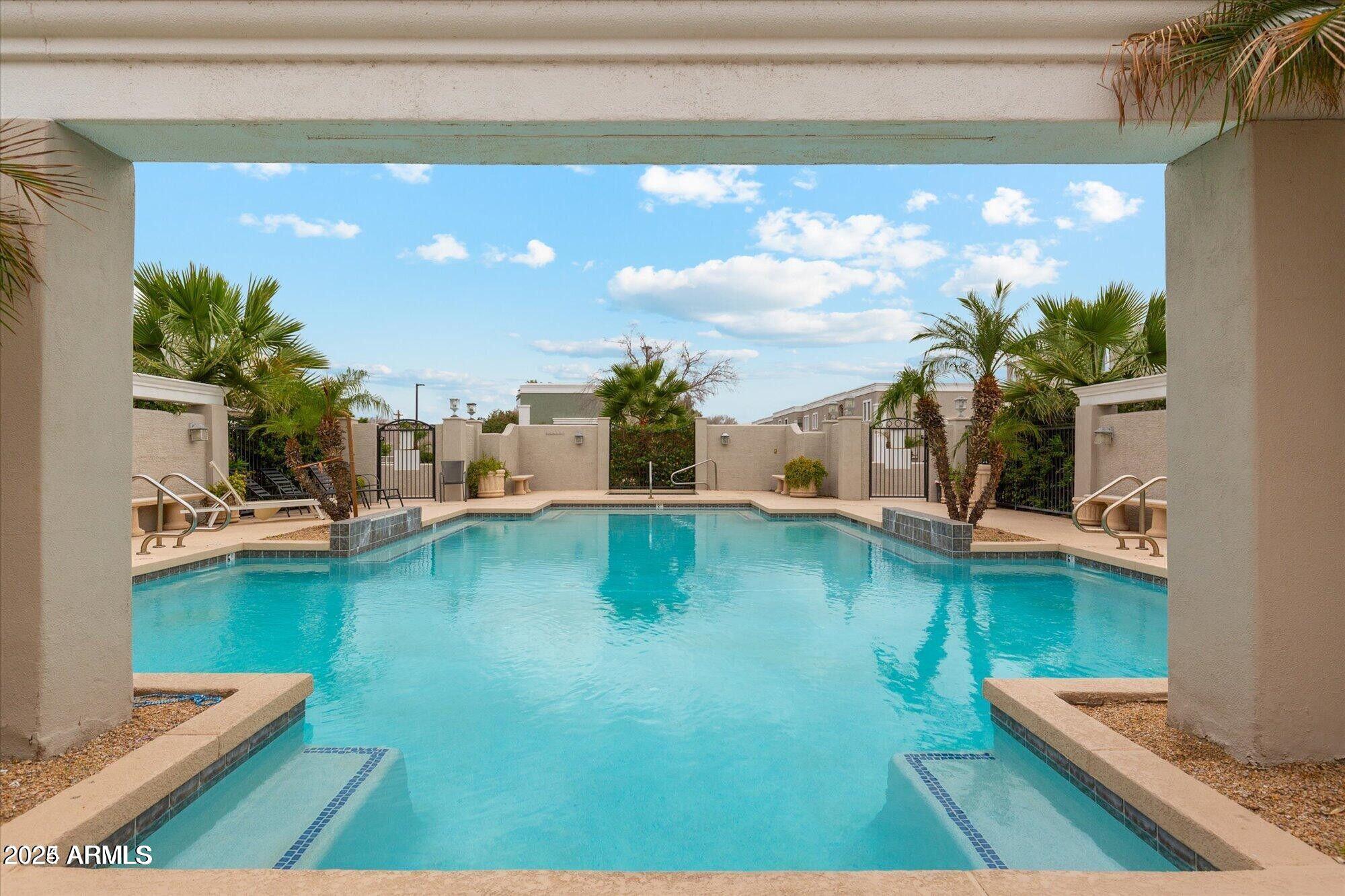 5210 North 16th Drive Phoenix, AZ 85015 - Photo 25 of 26 a swimming pool with trees in the background