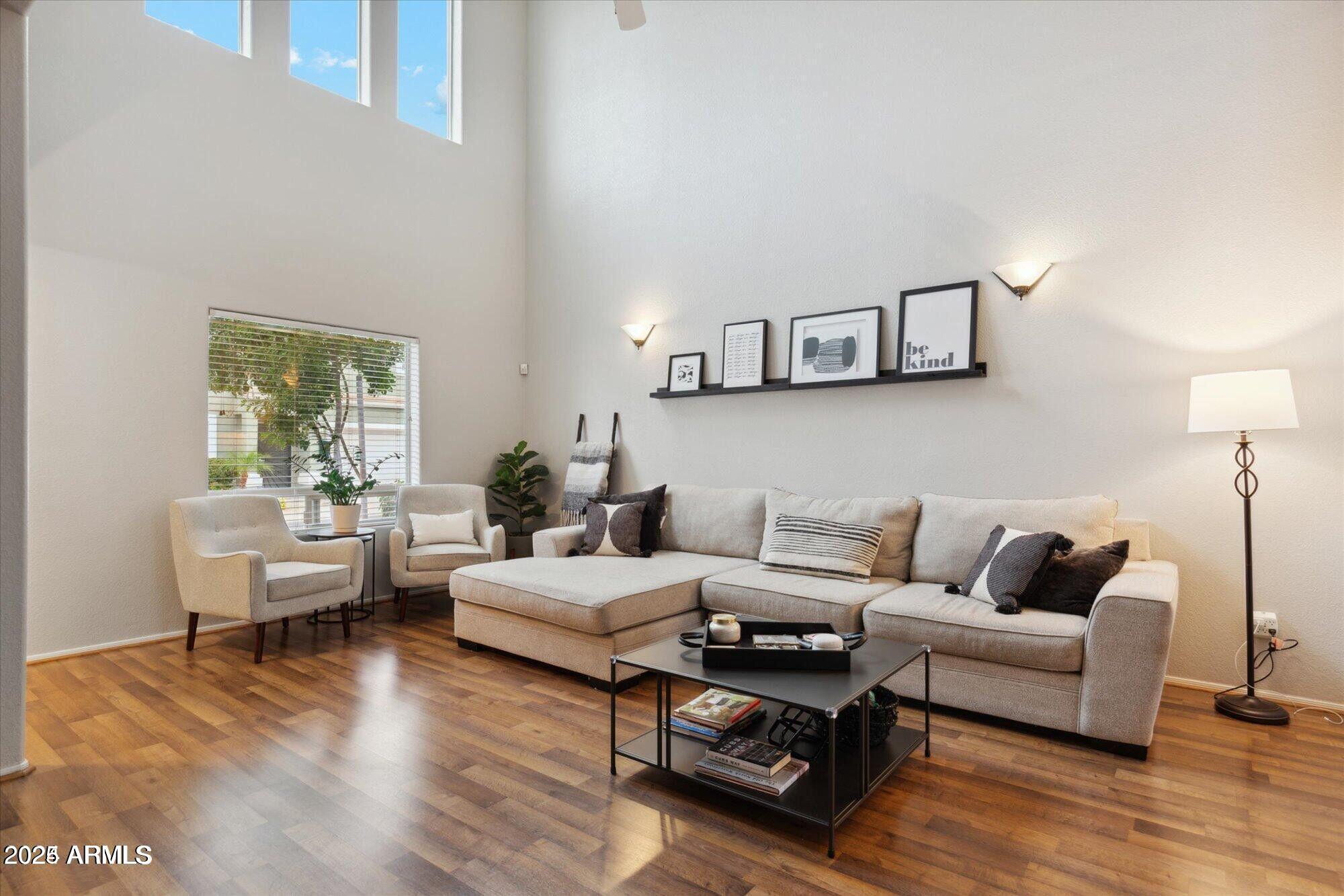 5210 North 16th Drive Phoenix, AZ 85015 - Photo 3 of 26 a living room with furniture and a wooden floor