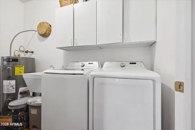a utility room with dryer and washer