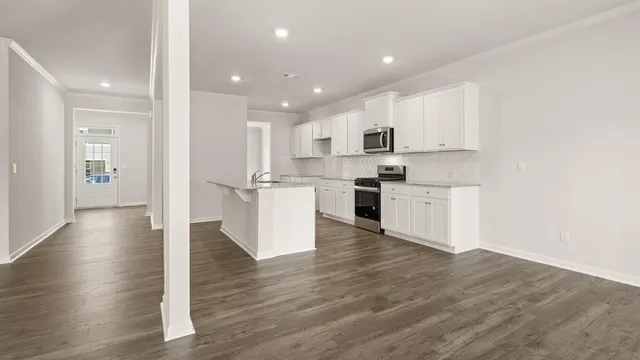 a view of kitchen with wooden floor