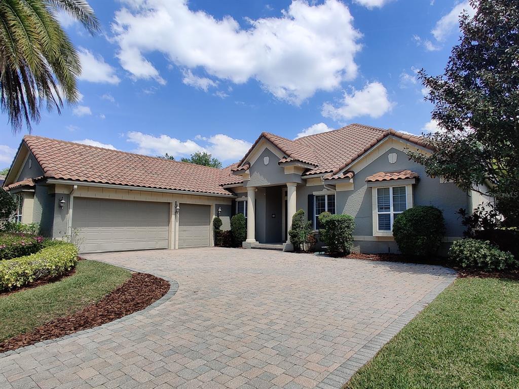 8463 Eagles Loop Circle Windermere, FL 34786 - Photo 1 of 1 a front view of a house with a garden