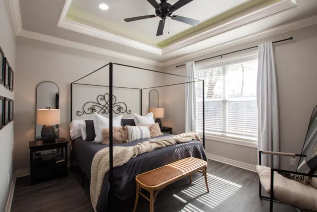 a bedroom with furniture and a window