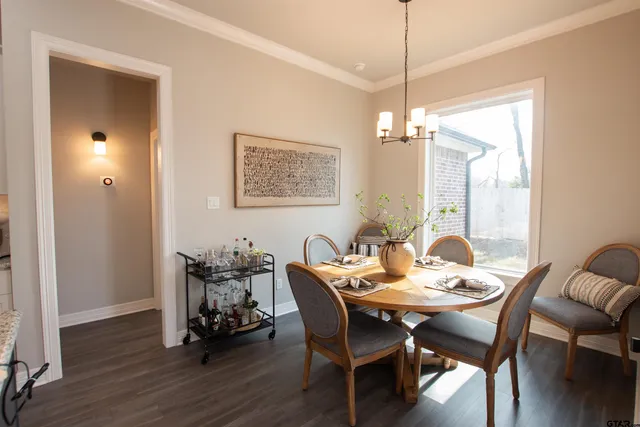 a dining room with furniture and window