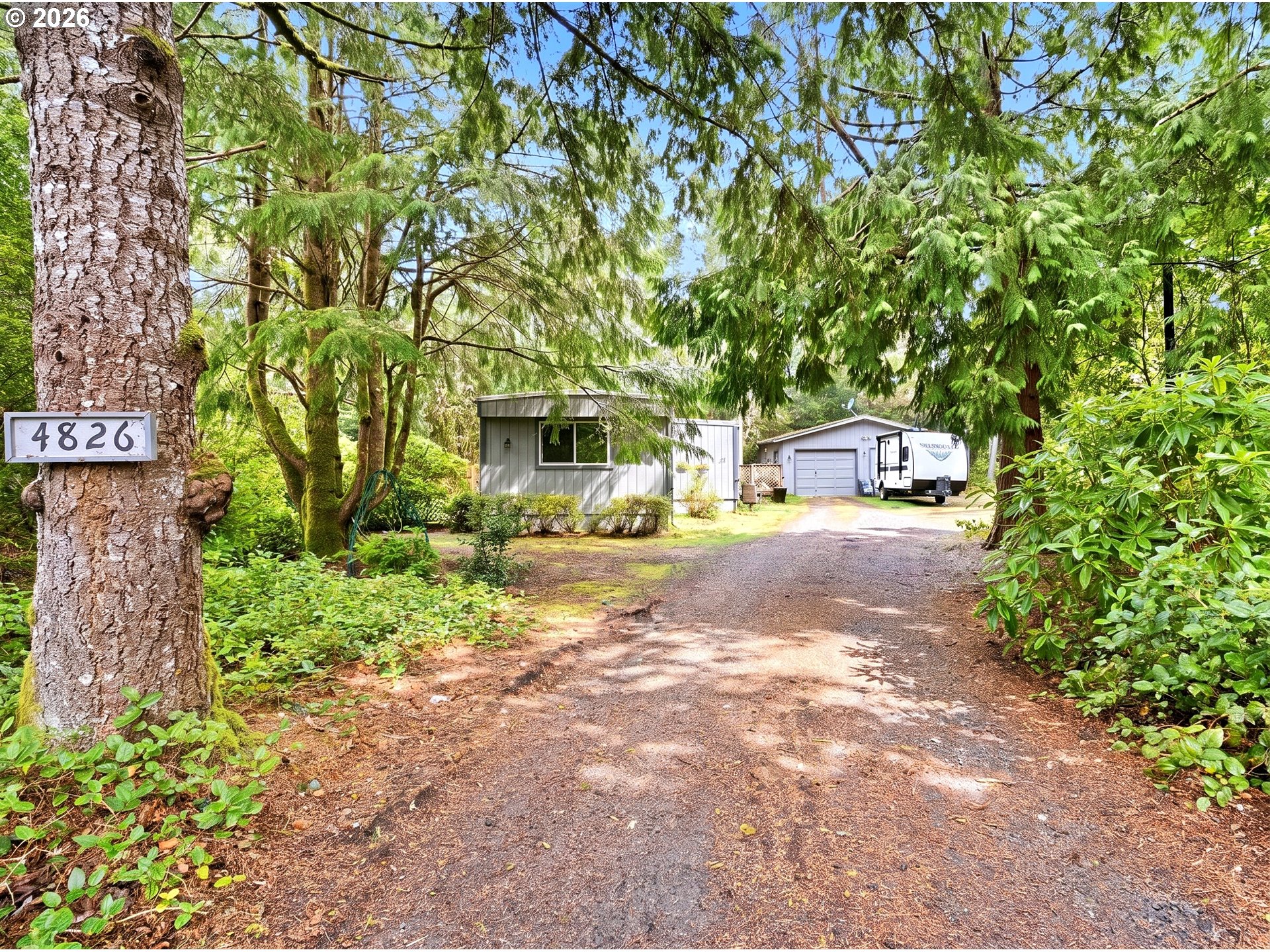 4826 Rhododendron Loop Florence, OR 97439 - Photo 2 of 41 a view of street with parked cars