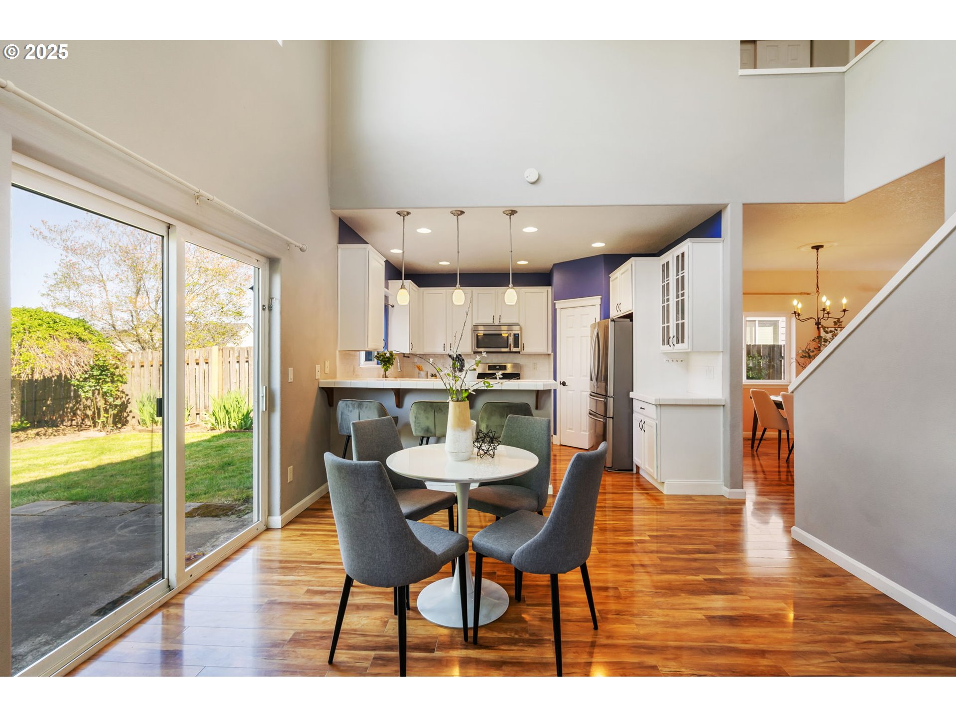 6379 Southeast 31st Terrace Gresham, OR 97080 - Photo 14 of 42 a dining room with furniture and a floor to ceiling window