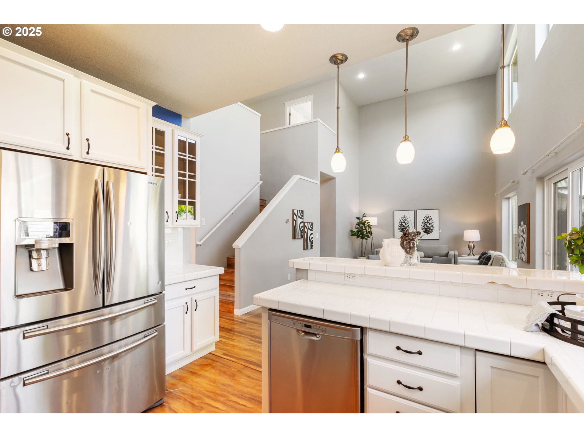 6379 Southeast 31st Terrace Gresham, OR 97080 - Photo 17 of 42 a kitchen with stainless steel appliances kitchen island a refrigerator and a sink