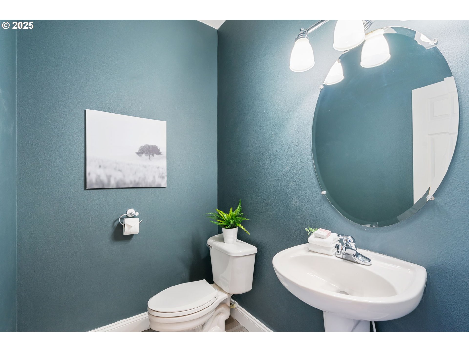 6379 Southeast 31st Terrace Gresham, OR 97080 - Photo 18 of 42 a bathroom with a toilet sink and mirror