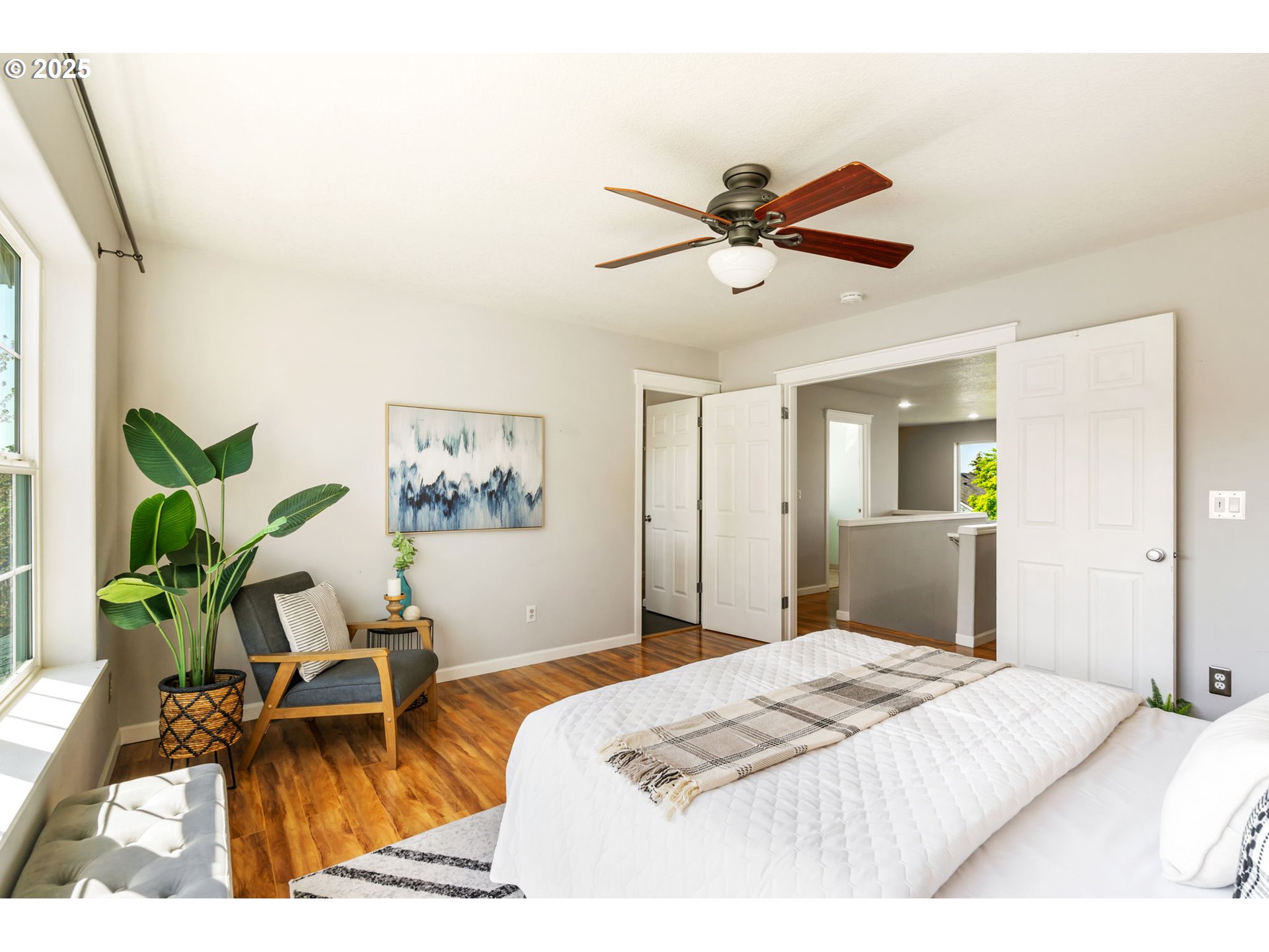 6379 Southeast 31st Terrace Gresham, OR 97080 - Photo 23 of 42 a bedroom with a bed and a chandelier