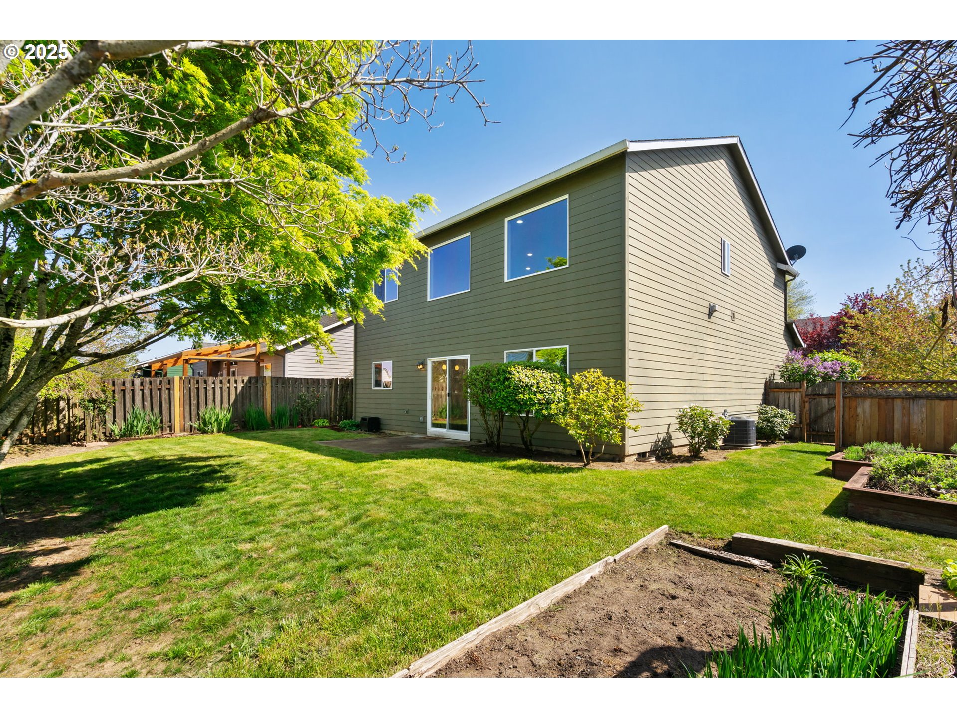 6379 Southeast 31st Terrace Gresham, OR 97080 - Photo 36 of 42 a view of a backyard with plants and large tree