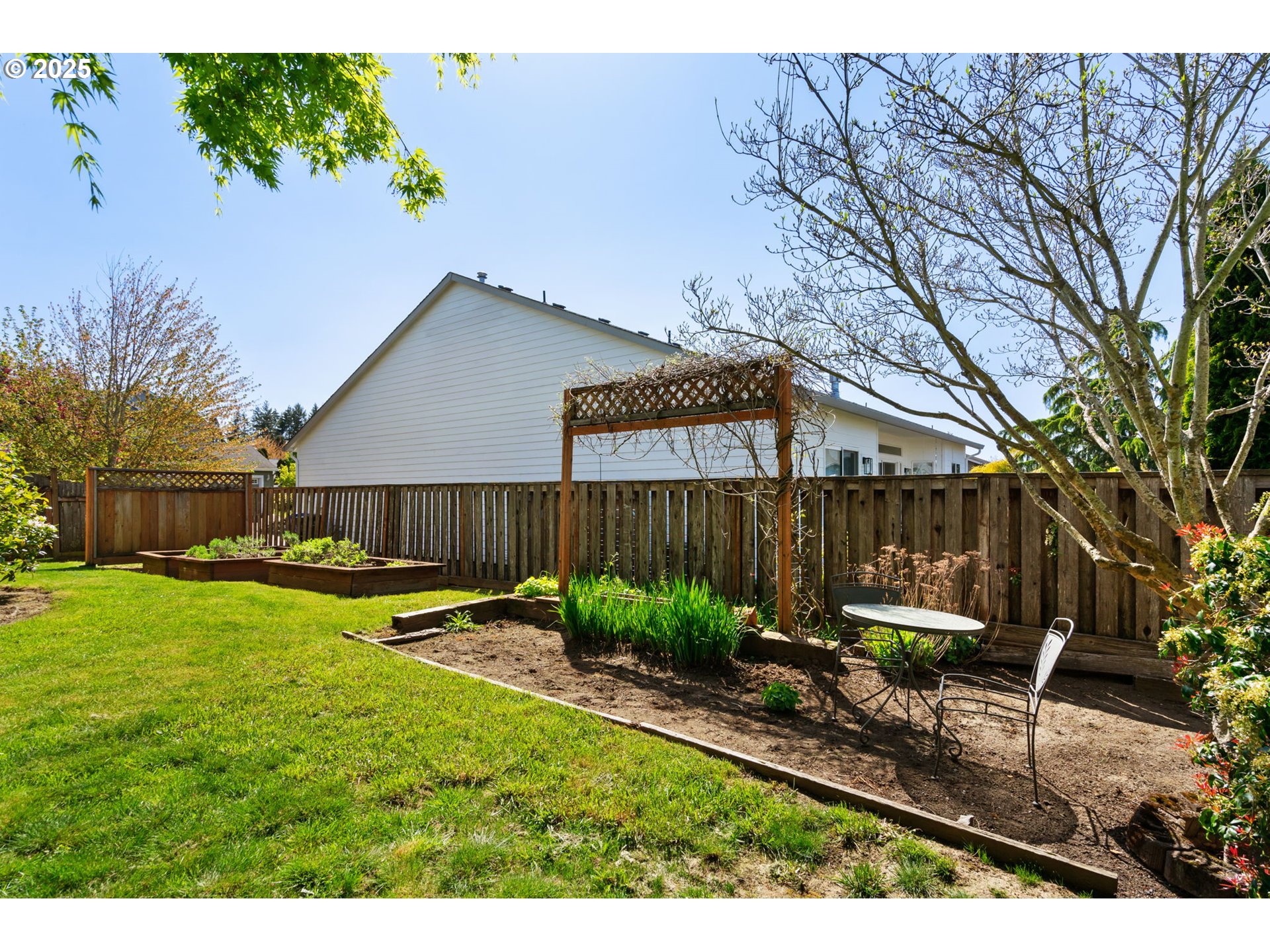 6379 Southeast 31st Terrace Gresham, OR 97080 - Photo 40 of 42 a view of a house with backyard and a garden