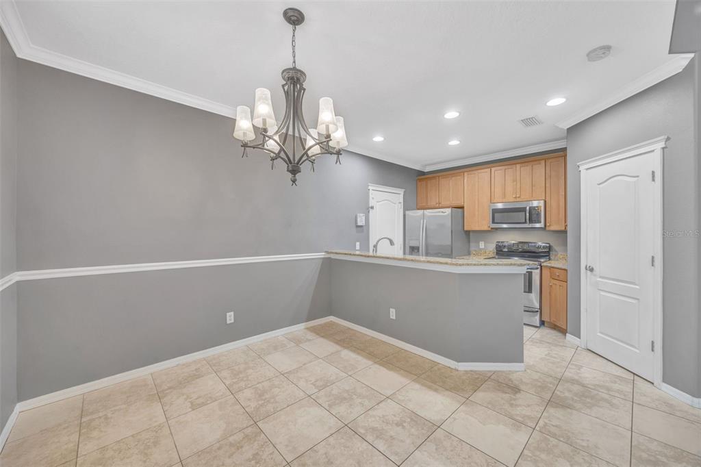 6020 Fishhawk Crossing Boulevard Lithia, FL 33547 - Photo 17 of 68 a view of kitchen with center island and stainless steel appliances