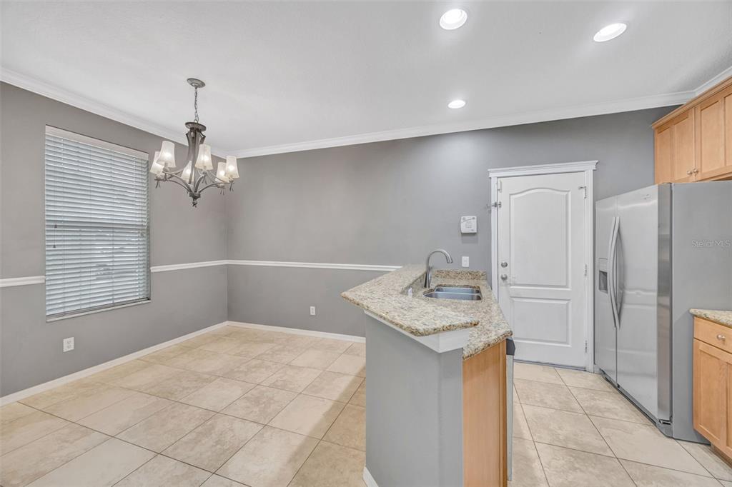 6020 Fishhawk Crossing Boulevard Lithia, FL 33547 - Photo 18 of 68 a bathroom with a sink a mirror and a shower