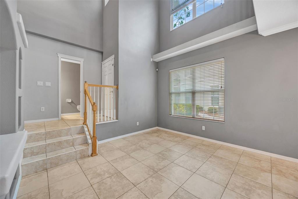 6020 Fishhawk Crossing Boulevard Lithia, FL 33547 - Photo 20 of 68 a view of an empty room with window and chandelier fan