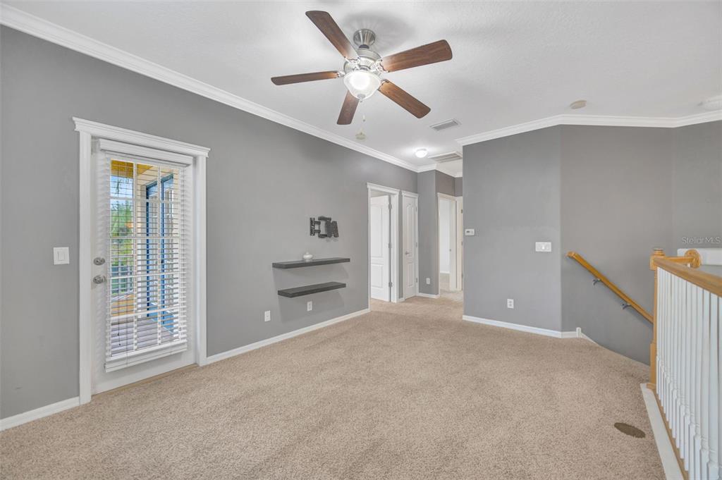 6020 Fishhawk Crossing Boulevard Lithia, FL 33547 - Photo 31 of 68 a view of an empty room with a ceiling fan and a window